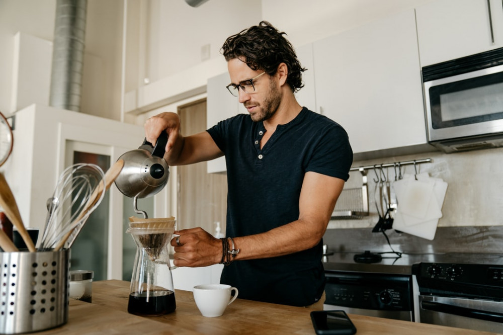 man making coffee at home